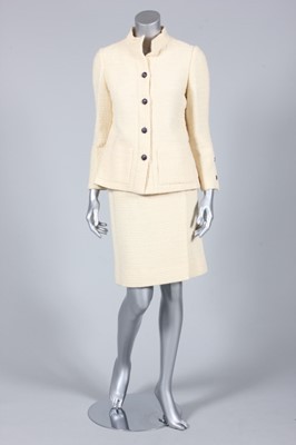 Lot 384 - A Chanel cream wool suit, 1970s, labelled...