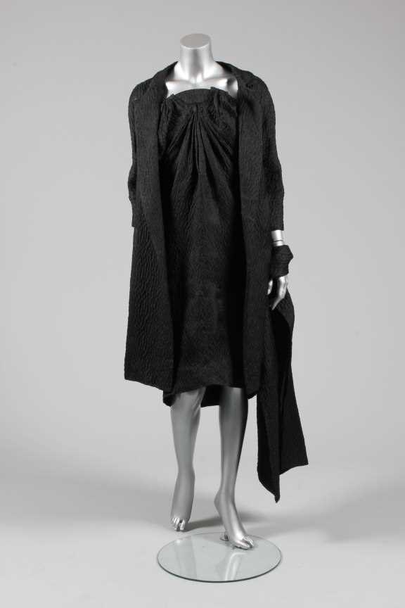 Lot 76 - A Balenciaga couture black cloqu satin...