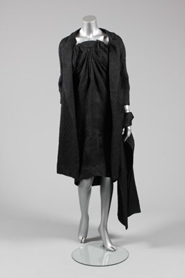 Lot 57 - A Balenciaga couture black cloqu satin...