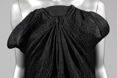 Lot 76 - A Balenciaga couture black cloqu satin...