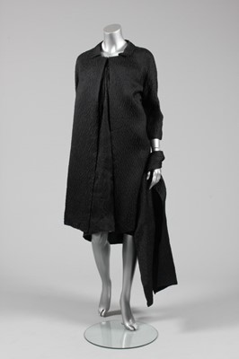 Lot 76 - A Balenciaga couture black cloqu satin...