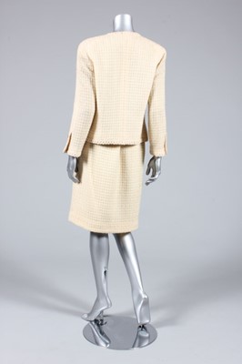 Lot 73 - A Chanel cream wool suit, 1970s, boutique...