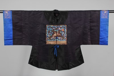 Lot 87 - A midnight blue satin surcoat applied to front...