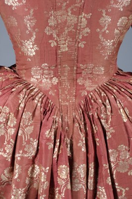 Lot 26 - A brocaded silk open robe and petticoat, 1760s,...