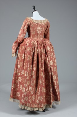 Lot 26 - A brocaded silk open robe and petticoat, 1760s,...
