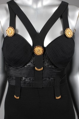 Lot 123 - A Gianni Versace black 'bondage' catsuit,...