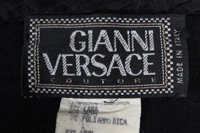 Lot 123 - A Gianni Versace black 'bondage' catsuit,...