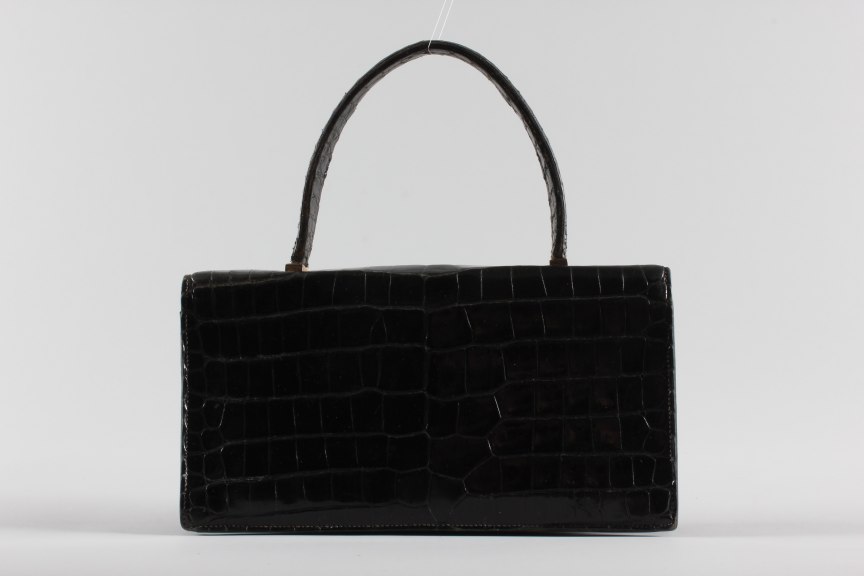 Lot 8 - An Hermès black crocodile `Piano' handbag,