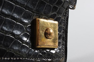 Lot 8 - An Hermès black crocodile `Piano' handbag,...