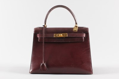 Lot 10 - An Hermès ox-blood leather Kelly bag, circa...