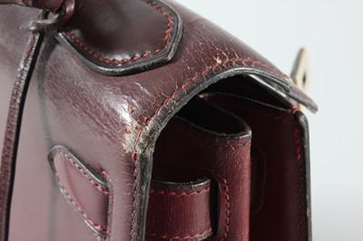 Lot 10 - An Hermès ox-blood leather Kelly bag, circa...