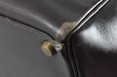 Lot 16 - An Hermès chocolate brown leather Kelly bag,...