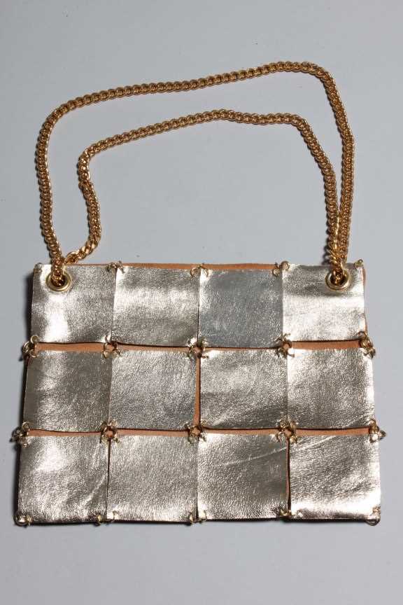 Lot 9 - A Paco Rabanne gold leather bag, 1960s, with...