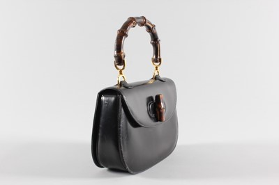 Lot 3 - A Gucci black leather 'bamboo' handbag, 1960s,...