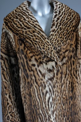Lot 90 - An ocelot swing coat, late 1950s, with shawl...