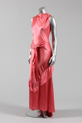 Lot 46 - A deep rose-pink satin bias cut couture...