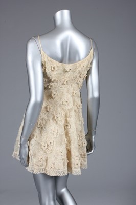 Lot 103 - A Lanvin ecru lace cocktail dress, early 1960s,...