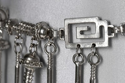 Lot 214 - A Versace 'Nuts and Bolts' metal chain belt,...