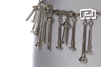 Lot 214 - A Versace 'Nuts and Bolts' metal chain belt,...