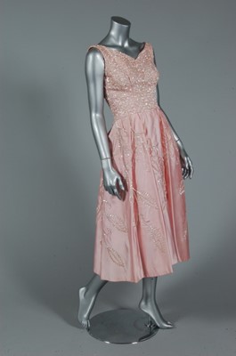 Lot 317 - An Emma Domb pink satin dance gown, circa 1955-...