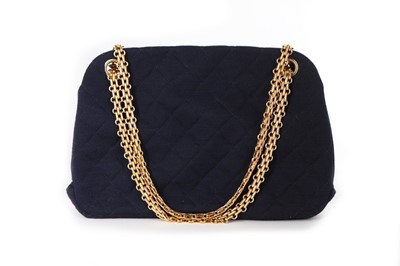 Lot 163 - A Chanel quilted navy wool handbag, 1960s,...