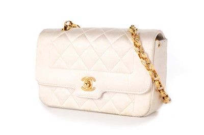 Lot 325 - A Chanel quilted white satin mini flap bag,...