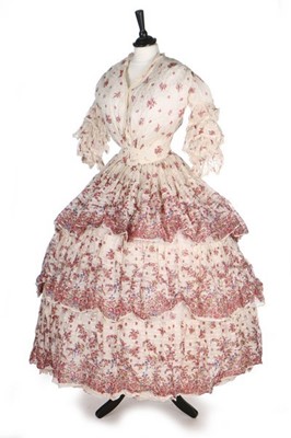 Lot 178 - A floral printed muslin dress, 1850s, with...