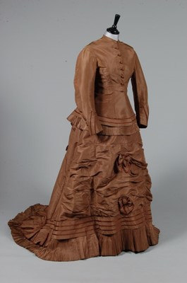 Lot 121 - A brown silk taffeta dress, mid 1870s,...