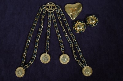 Lot 152 - A Chanel chain linked and leather belt, 1980s,...