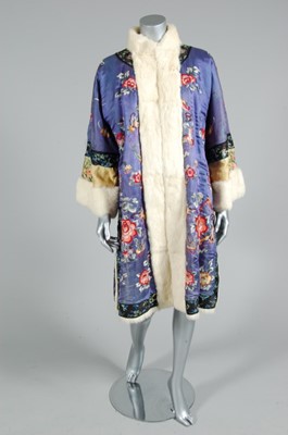 Lot 163 - A fur-lined embroidered Chinese robe, 1920s,...