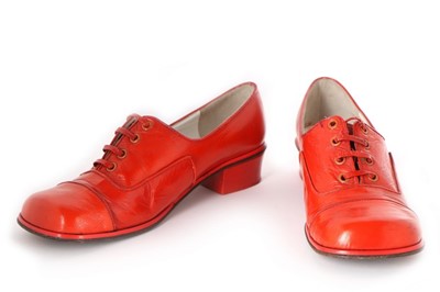 Lot 303 - A pair of Courrèges orange leather shoes,...