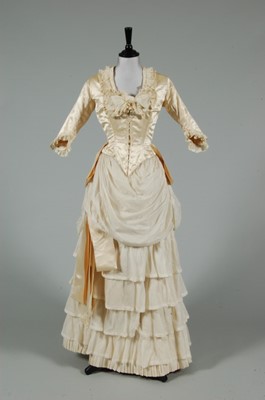 Lot 1 - An ivory satin and lawn bridal gown, late...