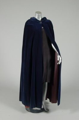 Lot 216 - A Biba blue velvet hooded evening cape, mid...