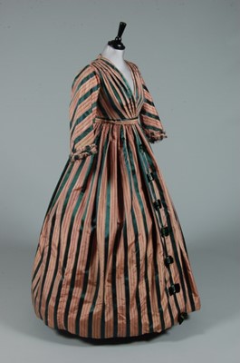 Lot 220 - A striped taffeta and satin gown, 1850s, but...