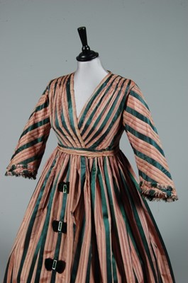 Lot 220 - A striped taffeta and satin gown, 1850s, but...