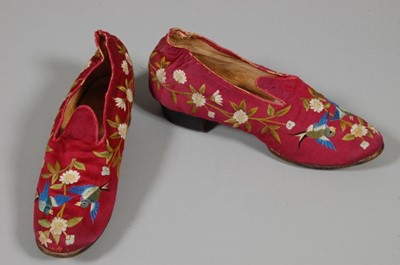 Lot 228 - A pair of Chinese embroidered shoes for the...