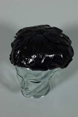 Lot 26 - A Balenciaga black lacquered raffia petal hat,...