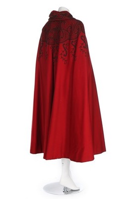 Lot 129 - A scarlet wool cape with couched black and...