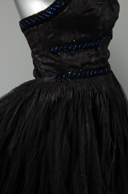 Lot 59 - A late Callot Soeurs couture cirsatin and...