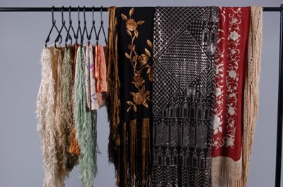 Lot 64 - A group of mainly fringed shawls, 1920s,...