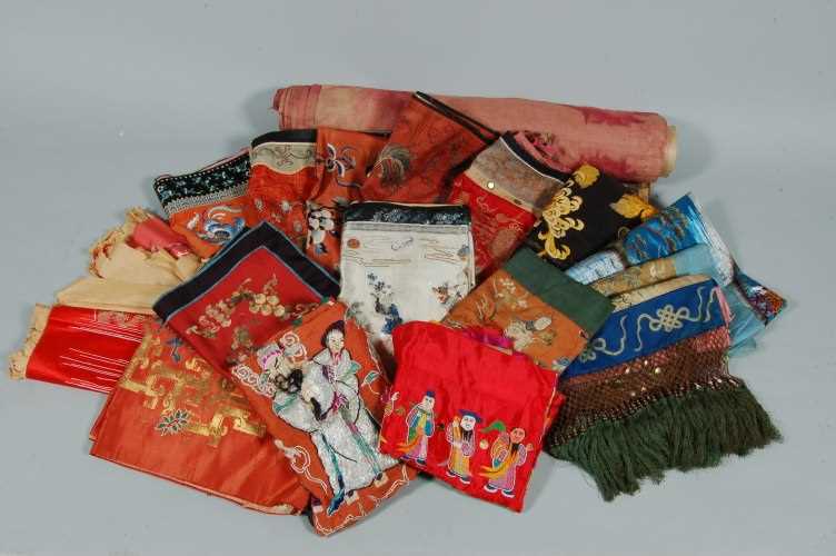 Lot 66 - A group of embroidered wall hangings, Chinese...