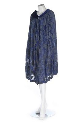 Lot 103 - A royal blue cut-velvet cape, circa 1930,...