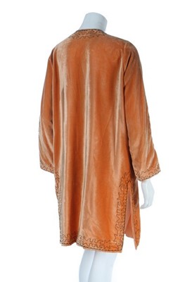 Lot 104 - An orange velvet evening jacket, 1920s, the...