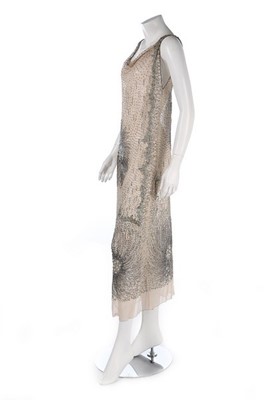 Lot 107 - A good embellished nude tulle evening dress,...