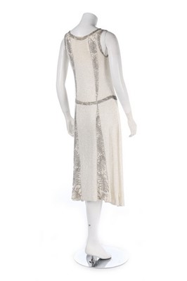 Lot 109 - A beaded white muslin flapper dress, circa...