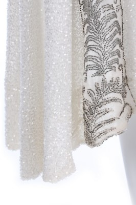Lot 109 - A beaded white muslin flapper dress, circa...