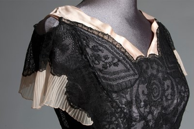 Lot 101 - A black bias-cut chiffon and Chantilly lace...