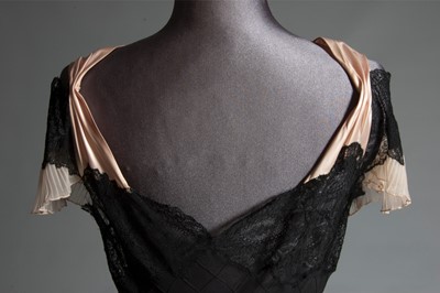 Lot 101 - A black bias-cut chiffon and Chantilly lace...