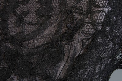 Lot 101 - A black bias-cut chiffon and Chantilly lace...