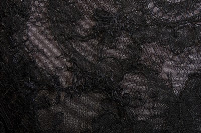 Lot 101 - A black bias-cut chiffon and Chantilly lace...